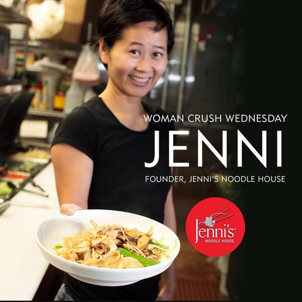Jenni, founder of Jenni's Noodle House, holding a bowl of Vietnamese noodles.
